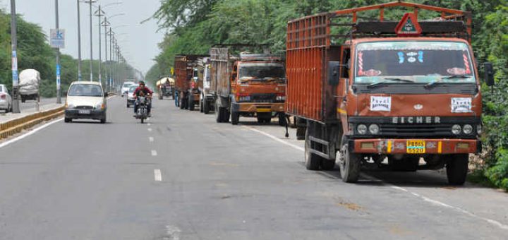 Truckers block highway to protest disbanding of unions, vow month-long stir